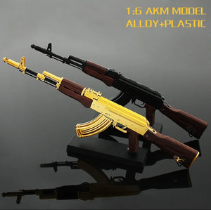The Mini AK is 11" / 28cm in length. The Wood gran is plastic with all other parts being die cast metal.