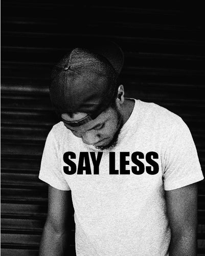 Say Less T Shirt on Model looking down Black and white picture