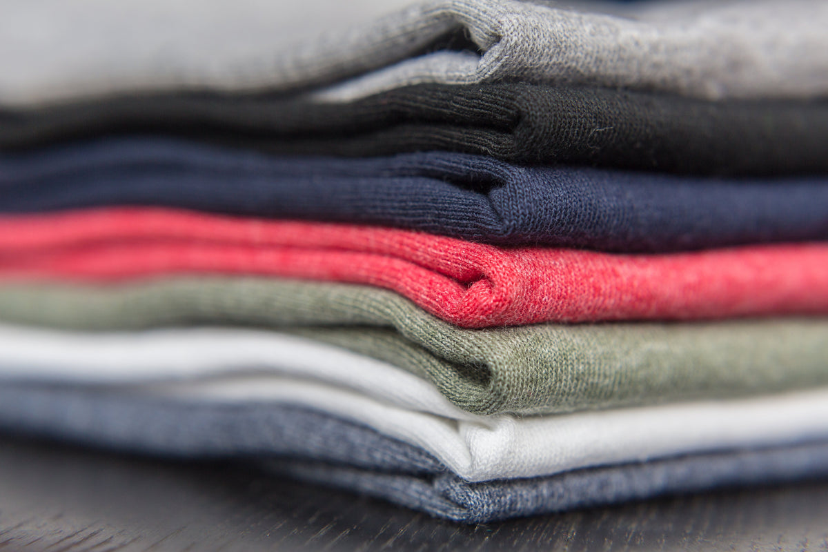 Stack of t shirts of  a few colors Trendie Days offers