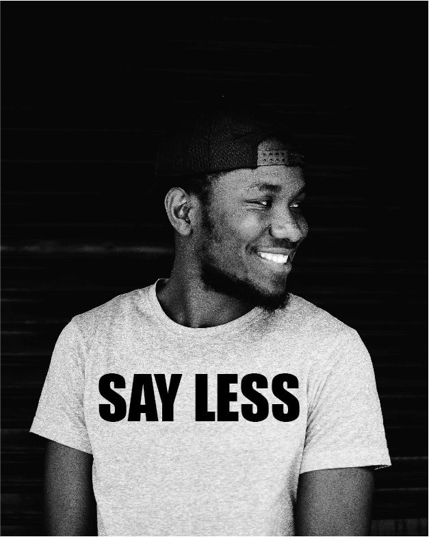 Say Less T Shirt on Model smiling looking sideways